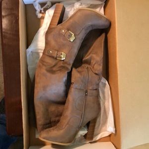 Tall pull on heeled boots.   #20